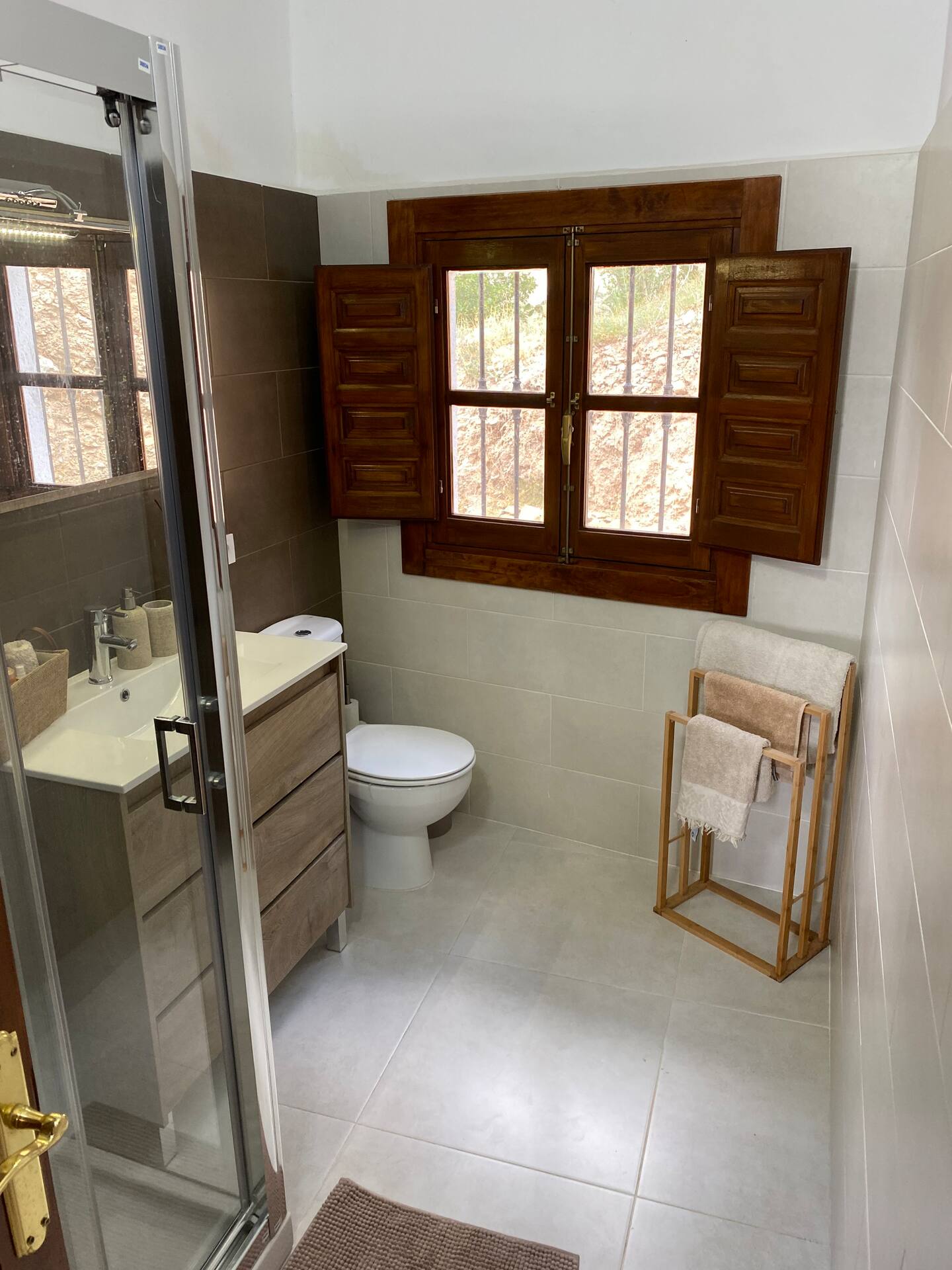 Modern bathroom with countryside window view